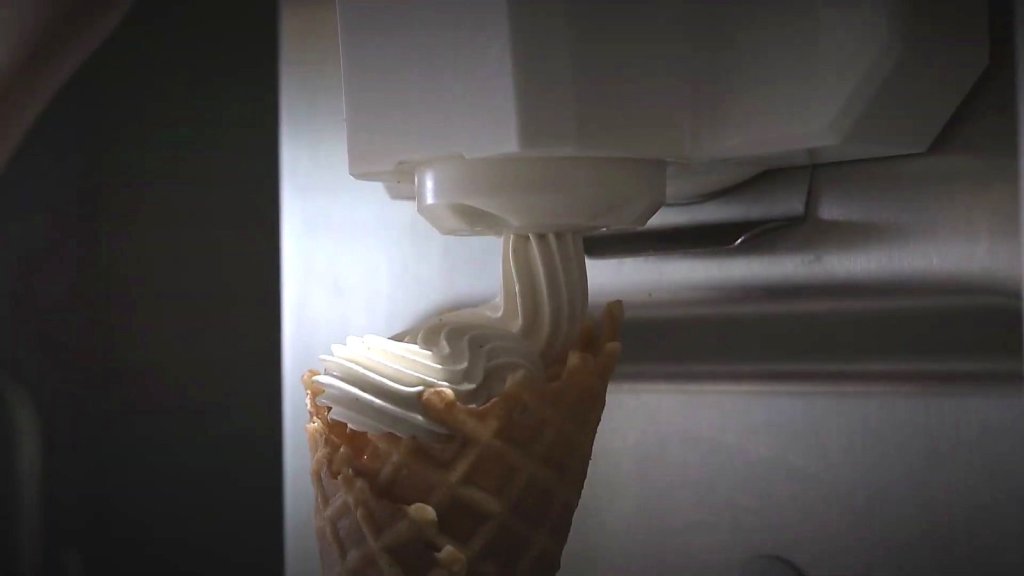 Carpigiani 191 Steel pouring soft serve into a waffle cone