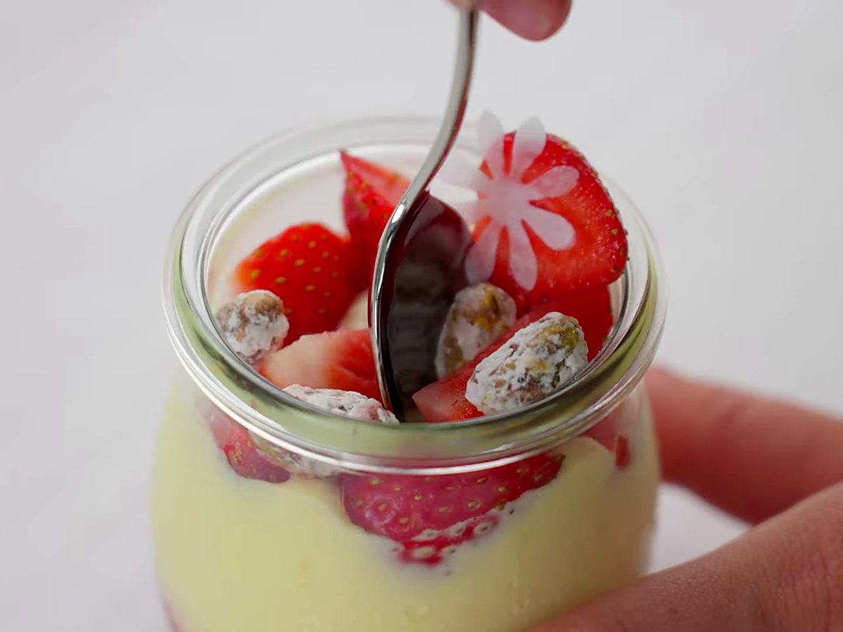 A jar dessert of gelato, strawberries and crunchy meringue.