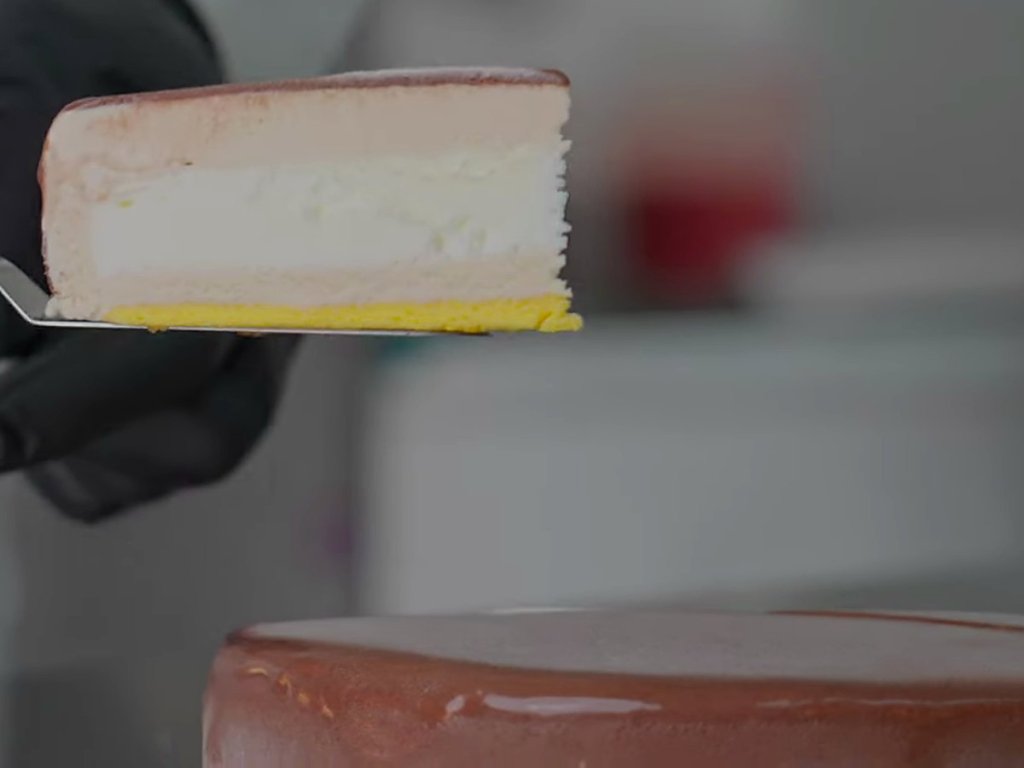 Slice of gelato cake lifted on a cake server
