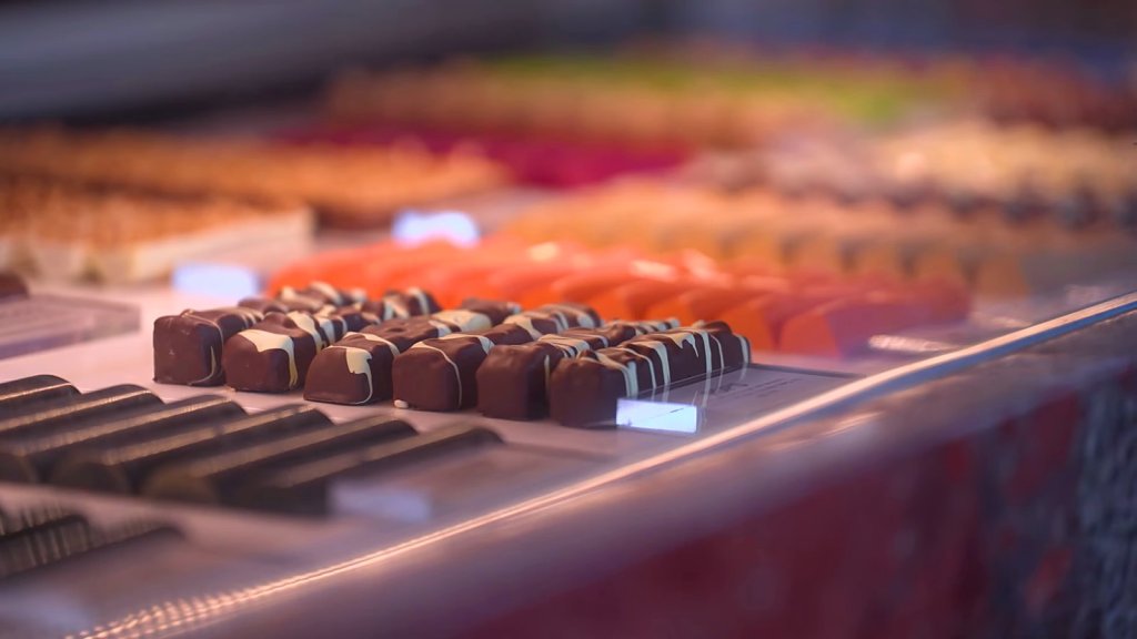 Rows of handmade bonbons in a display