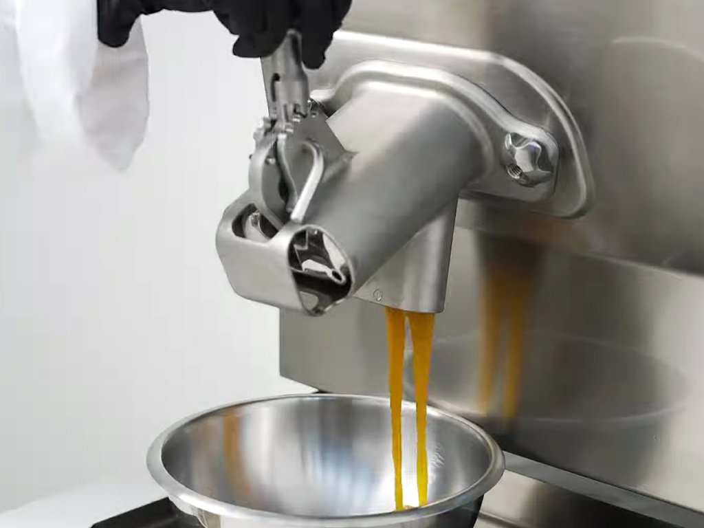Caramel pouring from the four-position tap