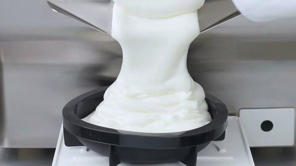 White gelato extruding into a container