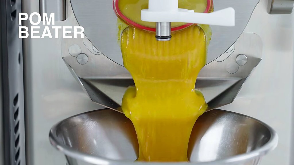 Yellow gelato extruding past the POM beater