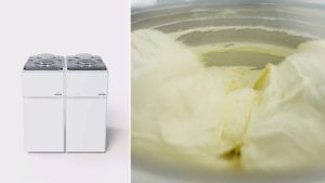 Twin Carpigiani Synthesis units beside a cylinder of freshly made gelato