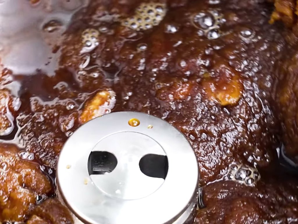 Bubbling caramel churning in the cylinder