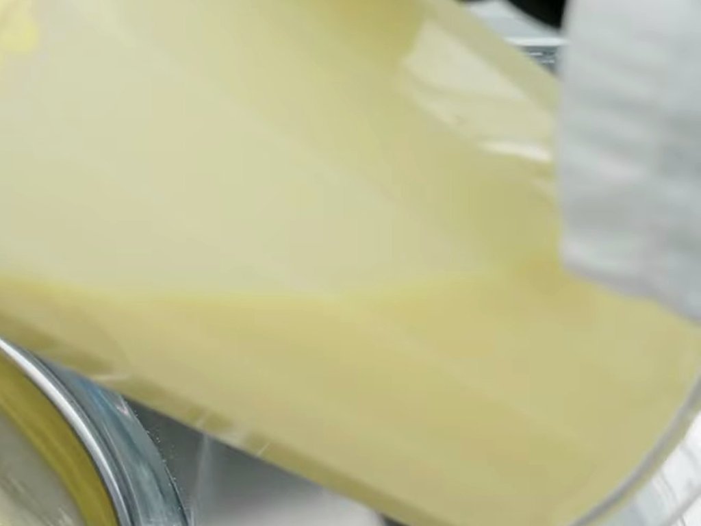 Fresh mix poured from a jug into a part-full cylinder