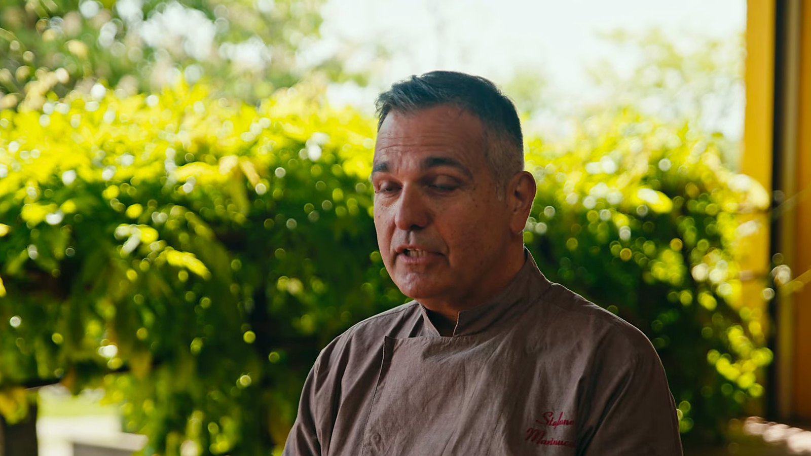 On the terrace, explaining his approach.