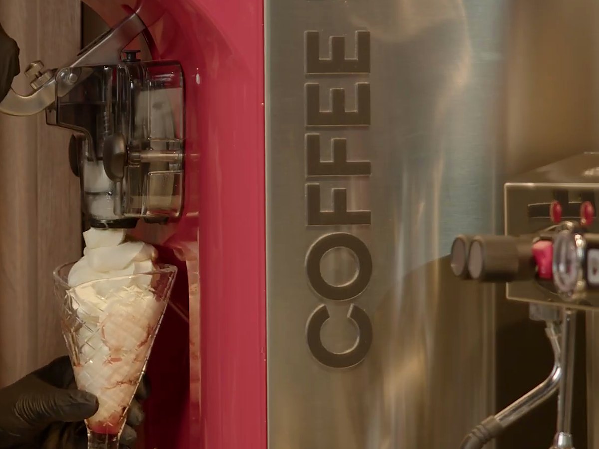 Filling the glass at the machine.