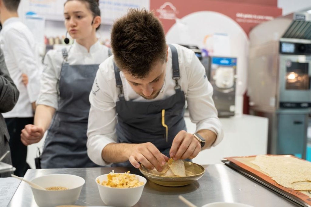 Chef Lorenzo Cogo preparing a gelato dish at Host 2019
