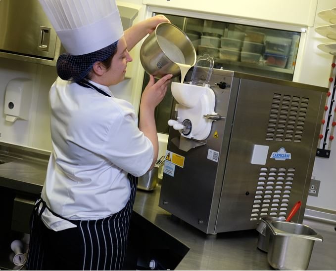 Michel Roux with chefs in The Waterside Inn kitchen