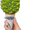 Hand holding a Rubicone cone piped with vibrant green matcha soft serve