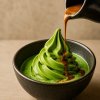 Espresso poured over matcha soft serve affogato