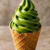 Matcha soft serve in a waffle cone